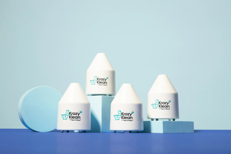 Four capsules on a studio set